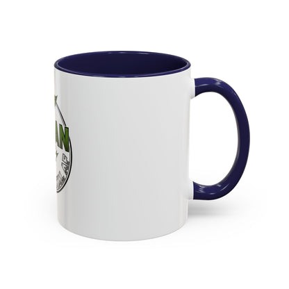 Glossy ceramic coffee mug with Vegan Heavy Metal Logo featuring leafy green "VEGAN" text and crossed lightning bolts on white background with colored handle and interior