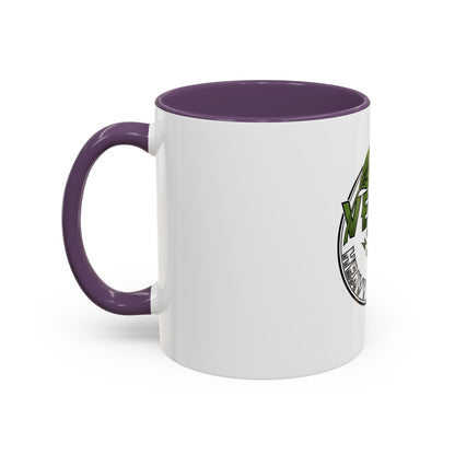 Glossy ceramic mug with Vegan Heavy Metal Logo, leafy green letters and crossed lightning bolts, white body with colored handle and interior